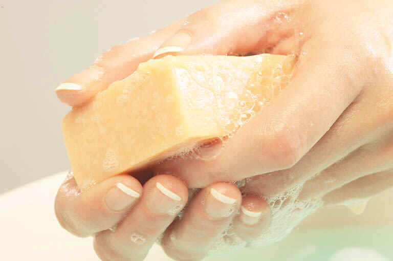 Woman Washing Hands with Soap Bar